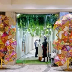 A festive and colorful entrance designed for a Navratri celebration. We used an array of traditional embroidered umbrellas to create a welcoming arch, setting a vibrant tone for the event right from the lobby.