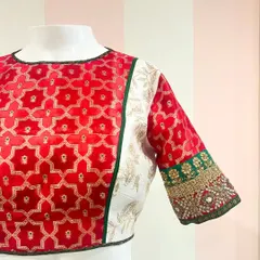 A side view of the multi-textured blouse on a mannequin, showing the different panels and the intricate sleeve work.