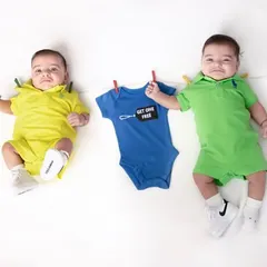 Buy one, get one free. This playful clothesline setup is another one of my favorite ways to photograph newborn twins, highlighting their special bond from the very beginning.