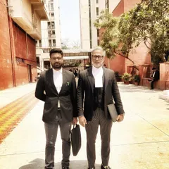 A moment captured at Dwarka District Court with a junior colleague. I make it a point to work alongside young lawyers, giving them firsthand experience in case preparation and final arguments.