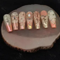 A closer look at one of my royal-themed press-on nail sets. The level of detail, with 3D elements, gems, and intricate patterns, shows the artistry that goes into each custom set.