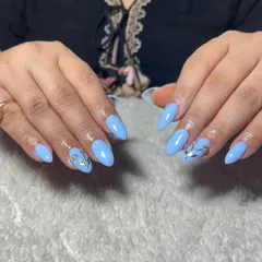 A lovely set of pastel blue almond nails with a 3D silver chrome accent on the ring finger.