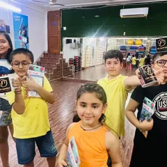 A close-up of the kids with their prizes. The smiles on their faces say everything. It’s important to me that they feel a sense of accomplishment.