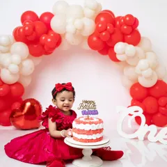 A happy smile as she enjoys her first birthday cake. I focus on capturing these expressions of pure joy.