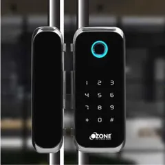 A sleek Ozone smart lock installed on a glass office door. This model requires no cutouts and offers four access methods: mobile app, fingerprint, RFID card, and PIN code, making it ideal for modern workspaces.