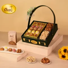 A sleek and modern dark green hamper basket. This design is perfect for those who appreciate a contemporary aesthetic, filled with a delicious assortment of my sweets and nuts.