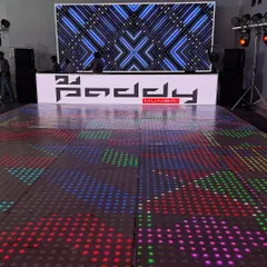 My signature setup, ready for a jam-packed Saturday night. This features a custom-branded DJ console, a large LED backdrop for dynamic visuals, and a pixel-mapped LED dance floor that changes with the music.