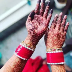 This is the beautiful, deep maroon stain my brides love. I achieve this color using my own 100% organic, chemical-free henna paste and will share all my aftercare secrets with you to make it last.