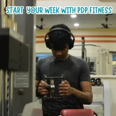 Get in the zone and start your week strong. A member using our cable machine for a focused back workout shows how our gym provides the right environment to tune out distractions and concentrate on your fitness goals.