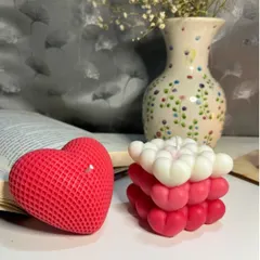 A closer look at our two signature heart designs together. The textured heart candle and the ombre heart bubble candle are both crafted to be beautiful decorative pieces that create a romantic ambiance.