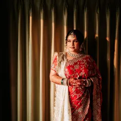A beautiful portrait of a bride getting ready, with the golden hour light streaming in.