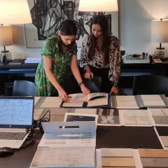 The design process is a tactile and collaborative one. Here, our team members are reviewing material samples and catalogues, a critical step where we select the textures, finishes, and colors that will define the character of a space.