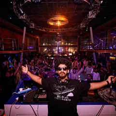 Commanding the stage at Cafe Mambo. My goal is to create a unified experience where the music and the crowd become one. This is the result of tracks built and tested for a packed house.