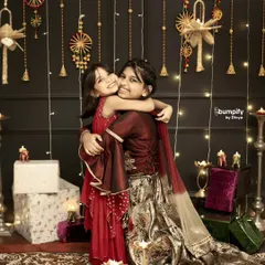 The bond between sisters is just pure magic. This candid moment from a Diwali family photoshoot, with the warm glow of diyas, is exactly the kind of memory I love to freeze in time.