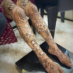 My full bridal packages include intricate designs for the legs, extending from toes to knees. This design features detailed floral and geometric patterns, ensuring a complete and stunning bridal look.