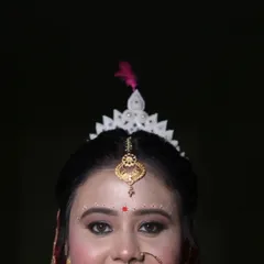 A close-up, artistic shot focusing on the traditional 'mukut' of a Bengali bride. This highlights my specialization in capturing the unique cultural details and accessories of regional weddings.