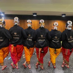 The Kalangan team, ready to perform. Our matching jackets with our names show our unity and pride as we prepare to go on stage together.