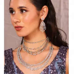 The right details complete the look. This shot highlights how our custom outfits provide the perfect canvas for your favorite jewelry, enhancing the overall elegance.
