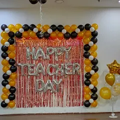 The full view of the Teacher's Day decoration, including a freestanding balloon bouquet with a star foil balloon. This shows how we can create a complete decorative zone within an office space for any special occasion.