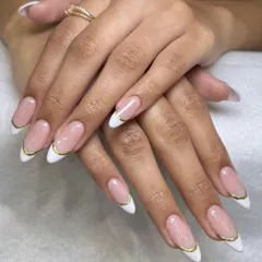 You can never go wrong with a classic French manicure, but I love adding a little twist. This elegant look features a delicate gold chrome line along the tip for a modern and sophisticated finish on these almond-shaped nail extensions.