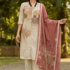 We love the earthy, muted tones of this printed kurta set. The abstract pattern in shades of beige and dusty rose gives it a soft, artistic feel. This is a versatile outfit that provides effortless style for any casual occasion.