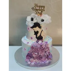 An elegant two-tiered concept cake I designed for Women's Day. The cascading sugar flowers and graceful silhouette celebrate femininity and strength.