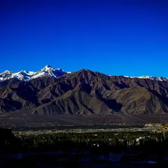 A wide, panoramic view of the Leh valley, with the formidable Himalayan range standing guard. This is the playground for our high-altitude training.