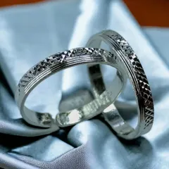 A pair of classic silver toe rings with a simple, etched pattern. These adjustable rings are a traditional and essential part of Indian bridal and everyday wear.