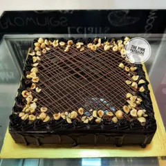 A large, rectangular chocolate hazelnut cake, perfect for serving a crowd.