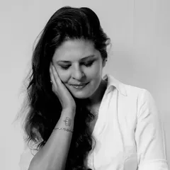 A softer, more pensive portrait in a simple white shirt. This shows that even the most basic wardrobe staples can be styled to show different emotions.