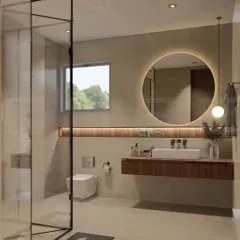 This bathroom combines earthy tones with modern fixtures. A large, round backlit mirror is the centerpiece above a floating wooden vanity, while the glass-enclosed walk-in shower creates an open and airy feel.