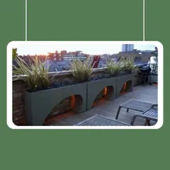 These arched planters are designed to make a statement, especially on a city terrace with a view. The open space underneath can be used for subtle uplighting, creating a beautiful silhouette against the evening sky.