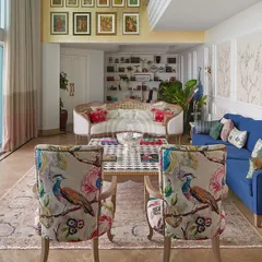 Your walls are a canvas waiting for a story. For this living room, I designed a custom wallpaper with delicate, blossoming branches, creating a serene and elegant backdrop that feels like stepping into a timeless garden.
