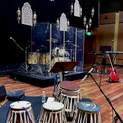 The stage is set for the show at NMACC. You can see my tablas in the foreground, with the drum kit and other instruments ready for the performance.