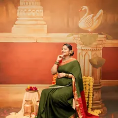 Inspired by vintage Indian art, this portrait with an olive green saree and traditional props is perfect for those who love a classic aesthetic.