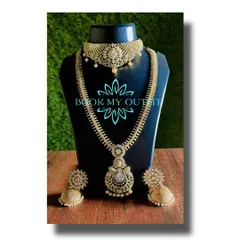 For a more modern reception or party look, I offer sets like this one. It features a beautiful choker and a matching long necklace studded with brilliant white stones that look just like diamonds, paired with elegant jhumkas.