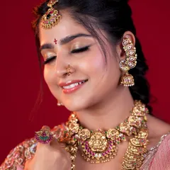 The beauty is in the details. This shot highlights the soft, blended eyeshadow and perfectly defined features that complete a South Indian bridal look, ensuring the bride feels confident and beautiful.