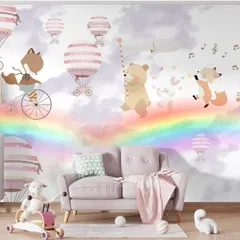 A full room view of the whimsical rainbow and animal wallpaper, perfect for a nursery or playroom.