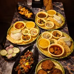 This is what we mean by 'barkat' or abundance. A table full of our thalis and starters, ready for friends and family to share. You can see our Assamese thalis, pork dishes, and fried starters, a true feast from the Northeast.