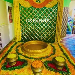 A beautiful floor arrangement for a Haldi ceremony. I created a floral rangoli using marigolds and other petals, with a central urli for the seating and smaller brass pots, all set against a traditional woven backdrop.