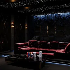 Transform your movie nights with a custom-designed home theatre. This one features grey and maroon tones, a cozy lounge sofa, and a star-like ceiling for the perfect cinematic ambiance. It's more than a space; it's an experience.