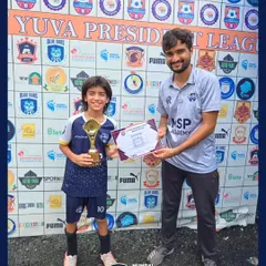 A player receives his award after a standout performance in the U11 Yuva President League.