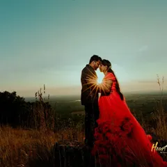 A duplicate of ID 128, capturing a breathtaking silhouette against a sunset, with the sun creating a perfect starburst between the couple.