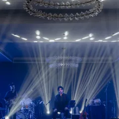 A powerful shot of Papon on stage, captured under dramatic lighting. This showcases our expertise in stage design and technical production to create a professional and immersive performance environment.