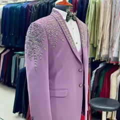 The unique lavender tuxedo showcased in my Lajpat Nagar store. The background gives you a peek at the extensive collection of outfits ready for customization.