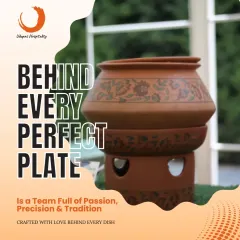 Behind every perfect plate is a team full of passion, precision, and tradition. This image of a traditional clay pot signifies our commitment to authentic cooking methods and the love crafted into every dish.