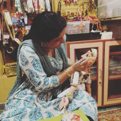 The final, most meditative step in bringing a puppet to life is painting the face. Each brushstroke adds character and soul. This is a quiet moment in my workshop where I am giving expression to a new wooden puppet, a process I am passionate about sharing with my students.