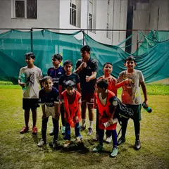A team photo of our young squad after a fun and intense training session in the rain. We believe in training hard and enjoying the process together.
