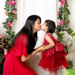 A sweet kiss between mother and daughter. These 'Mom & Me' sessions are a wonderful way to celebrate and document your special bond.