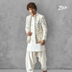 An all-white Pathani suit that exudes classic charm. The detailed embroidery on the jacket adds a layer of sophistication, making it a perfect choice for any grand celebration.